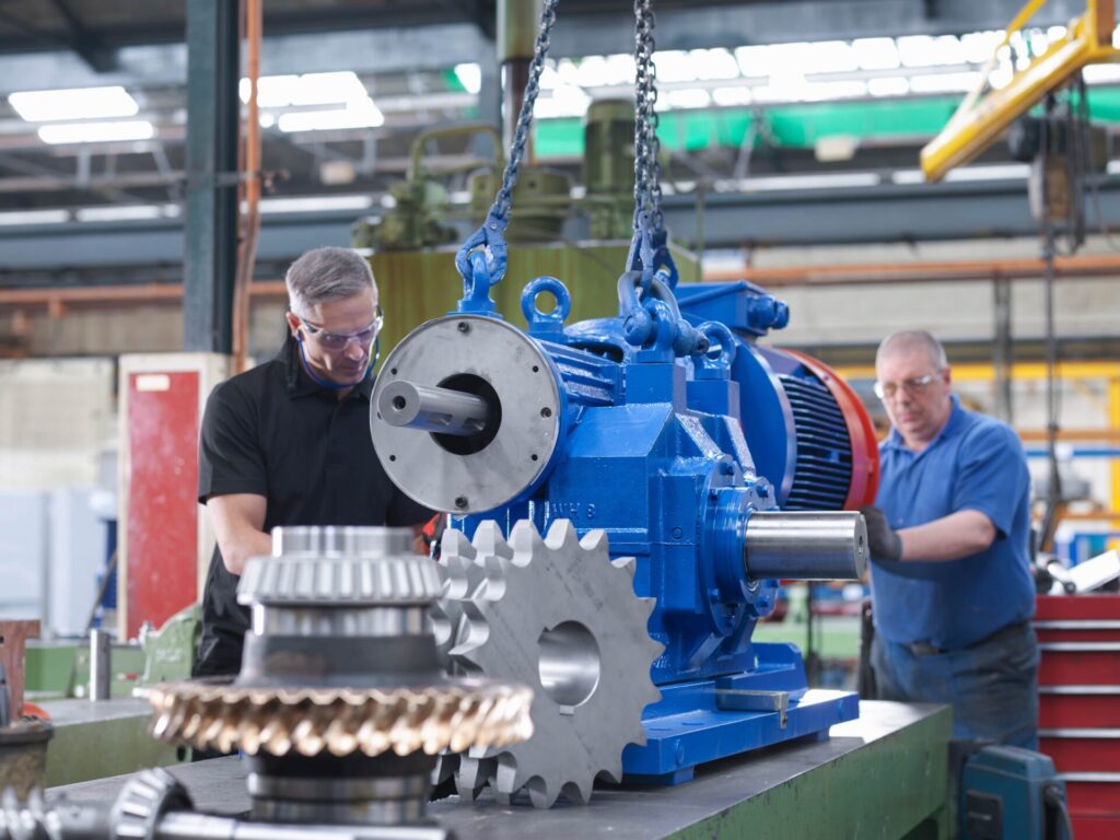 engineers-assembling-industrial-gearbox-in-enginee-2022-03-07-23-58-48-utc-min