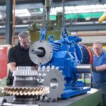engineers-assembling-industrial-gearbox-in-enginee-2022-03-07-23-58-48-utc-min
